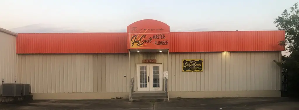 The Jim Snell Master Plumber shop at 3612 Nederland Avenue, orange awning and street numerals